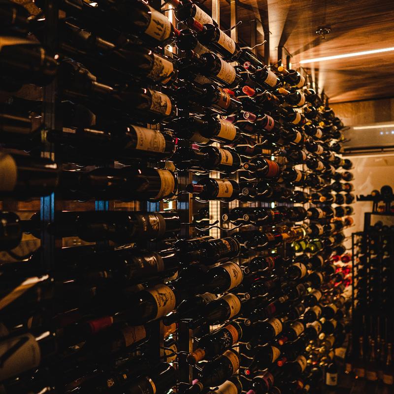 Wall-mounted wine bottle racks