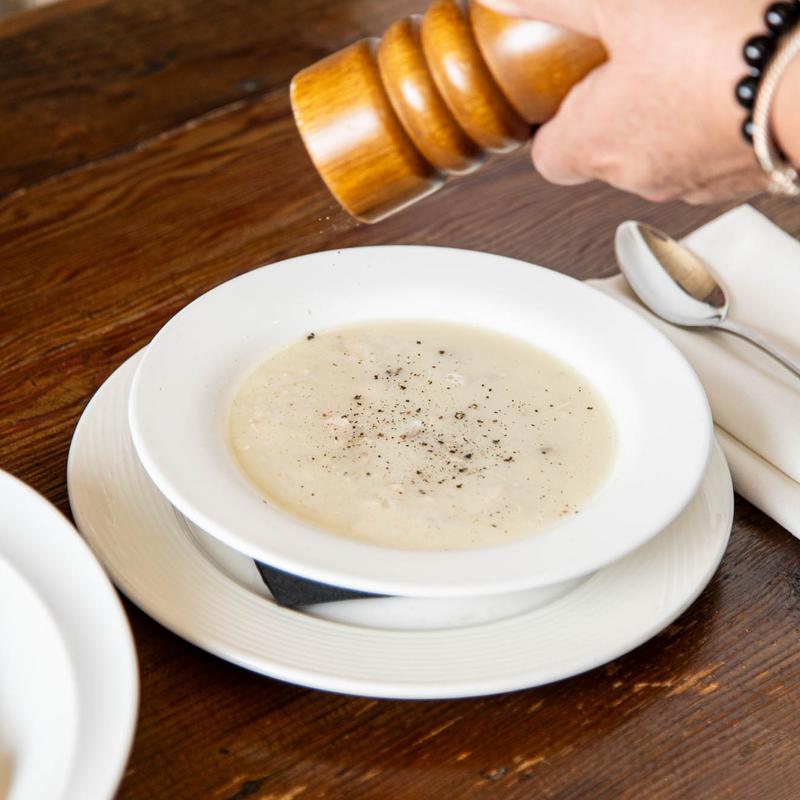 Avgolemono soup with egg, lemon, chicken, and rice