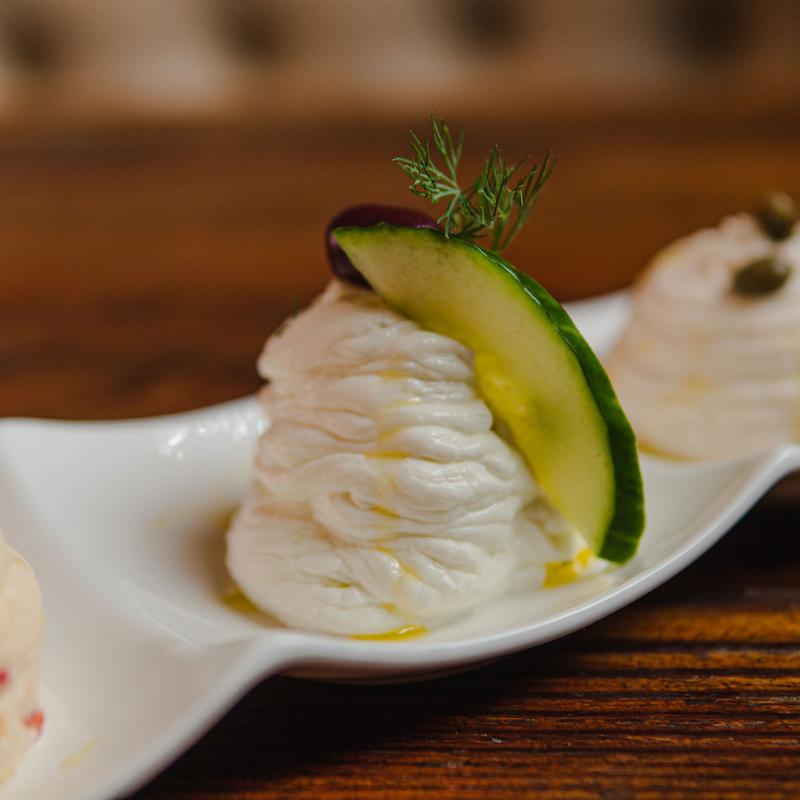Creamy dip garnished with cucumber and dill