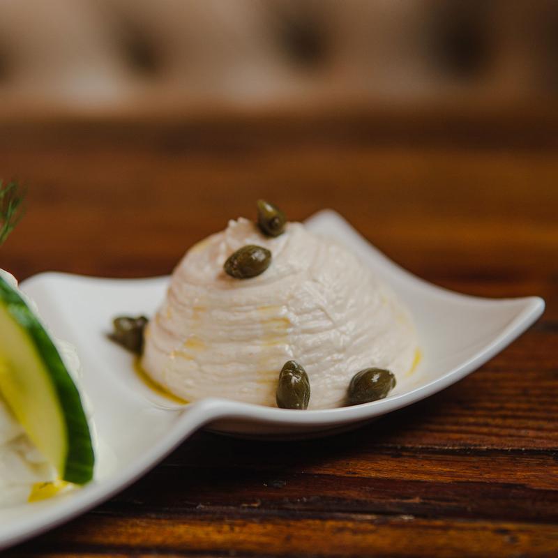 Creamy dip topped with capers