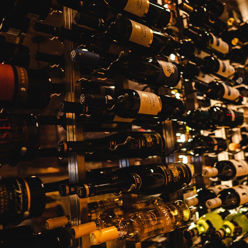 Bottles stored horizontally in a wine rack