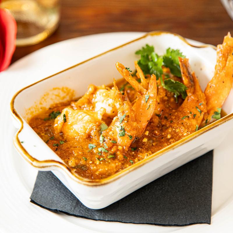 Garides saganaki shrimp in homemade tomato sauce with feta
